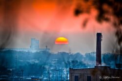 Sunset Amidst Smoke Stacks