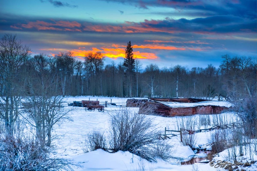 Sunset Over Winter Cabins
